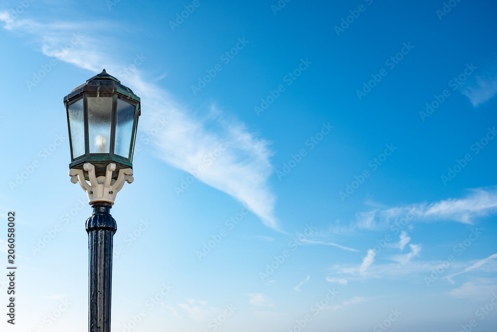 Old Fashioned Lamp on Blue Sky