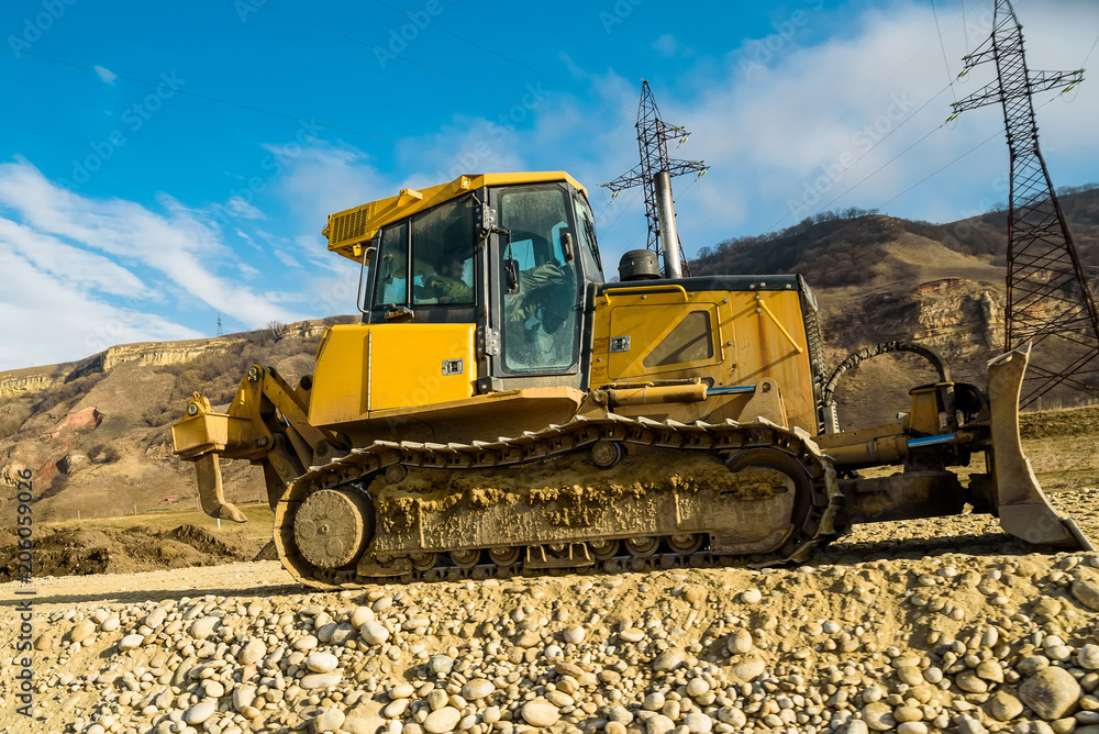 Road works with bulldozer in the country in fall Road works with bulldozer in the country in fall