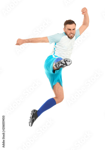 Young man playing football on white background