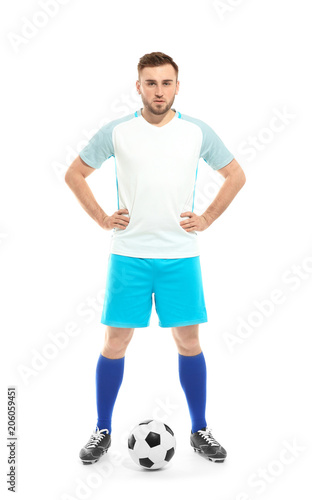 Young football player in uniform on white background © New Africa