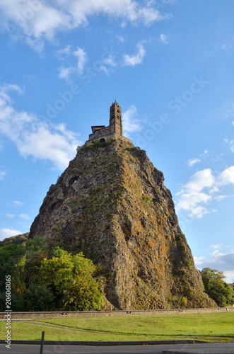 Ancient Chapel Saint Michel de Aiguilhe standing at a very steep volcanic needle (Le Puy en Velay, France) photo