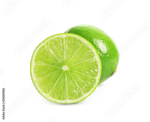 Fresh ripe green limes on white background