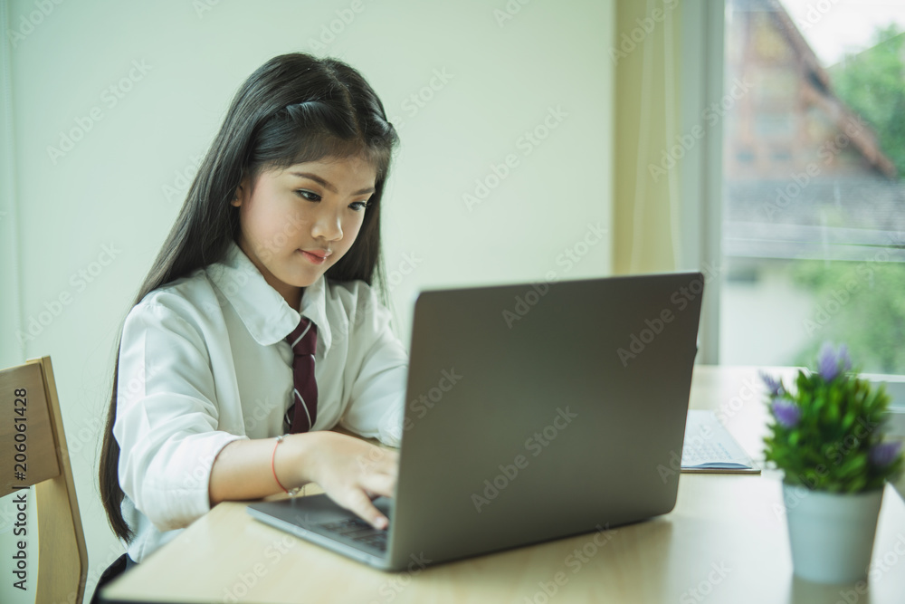 Young girl use of the laptop compute Young girl use of the laptop compute