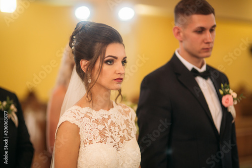 Bride and groom on wedding ceremony in church