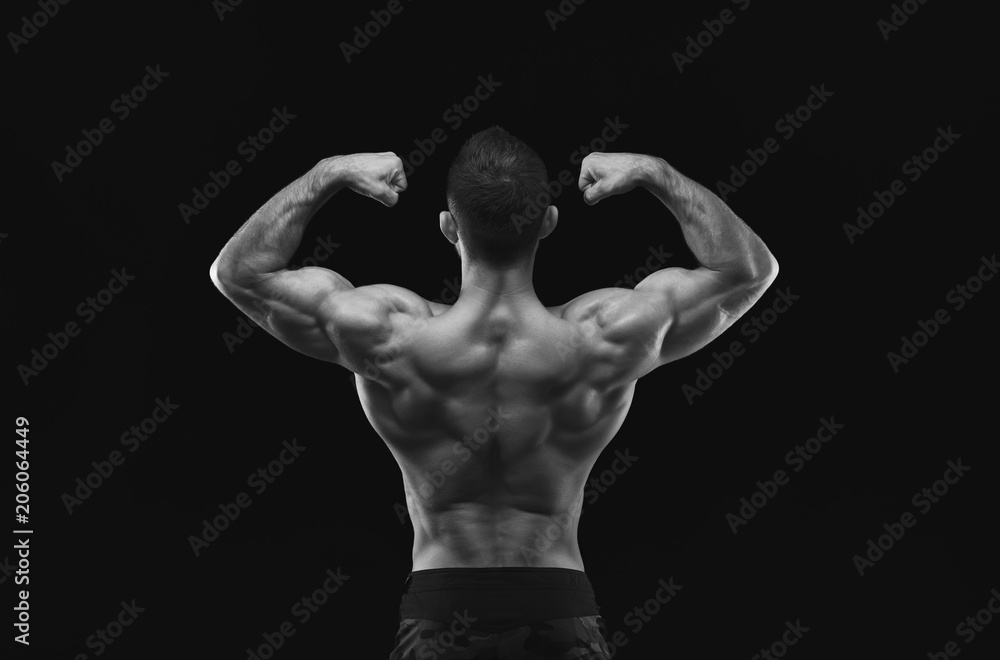 Obraz premium Unrecognizable man shows strong back muscles closeup