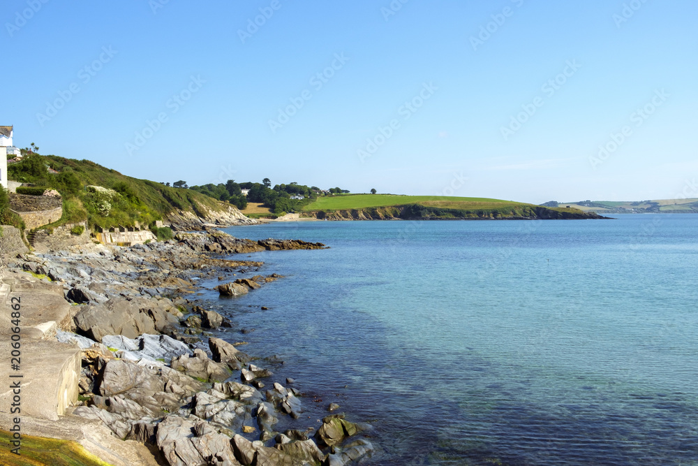 View of the coastline at Portscatho, Cornwall, UK on a beautiful summer morning.