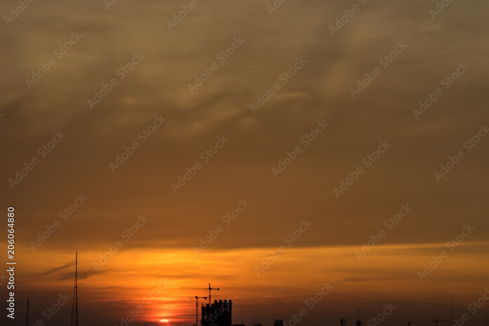 scenic of sunset sky with silhouette construction site