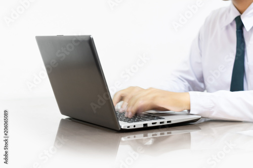 man's hands using laptop on white background