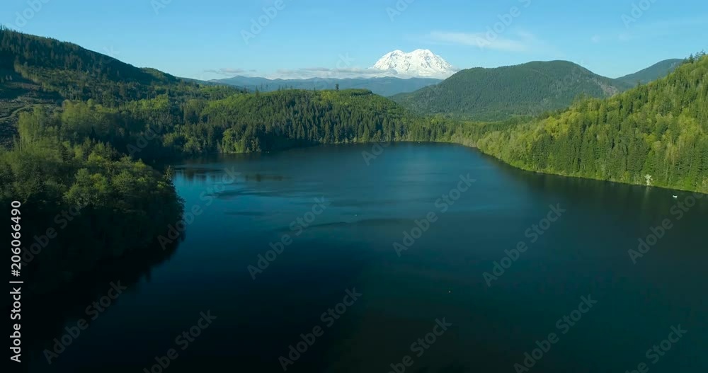 Aerial Panning Hills Above Lake Mt Rainer Snowy Peak Background Aerial Panning Hills Above Lake Mt Rainer Snowy Peak Background