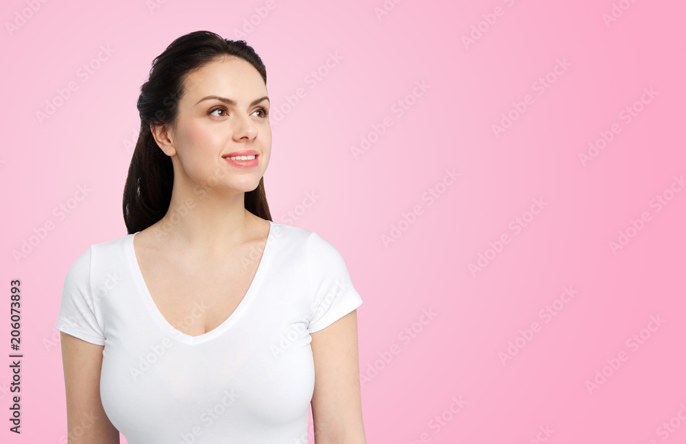 body positive and people concept - happy woman in white t-shirt over pink background body positive and people concept - happy woman in white t-shirt over pink background
