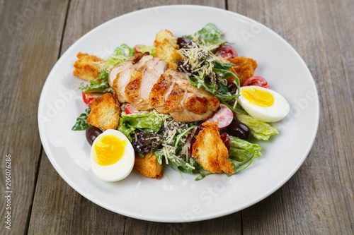 Caesar salad with fried chicken meat. Italian appetizer, gourmet food, banquet, restaurant menu concept
