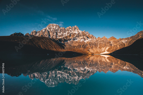 Wonderful panoramic view the Gokyo Lake on the mighty Himalayas mountains background. The protected area of the Sagarmatha National Park in the north-eastern Nepal. photo