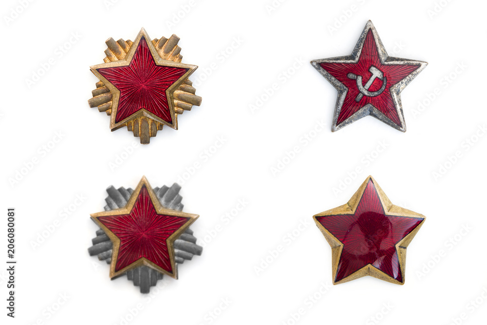 Obraz premium Old red stars from military caps isolated on the white background