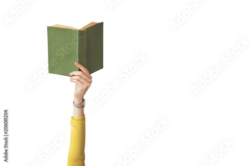 The hand holding book on isolated background photo