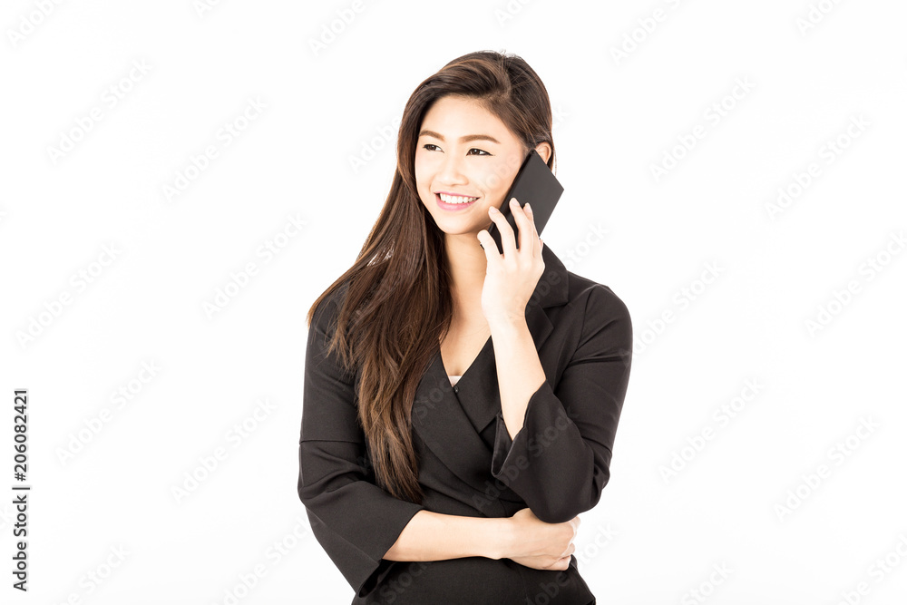 Asian young business woman wearing black suit smile and talk in smartphone with customer to get requirement and looking up,Feeling confident and having a service mind,Isolate on white,Business Concept Asian young business woman wearing black suit smile and talk in smartphone with customer to get requirement and looking up,Feeling confident and having a service mind,Isolate on white,Business Concept