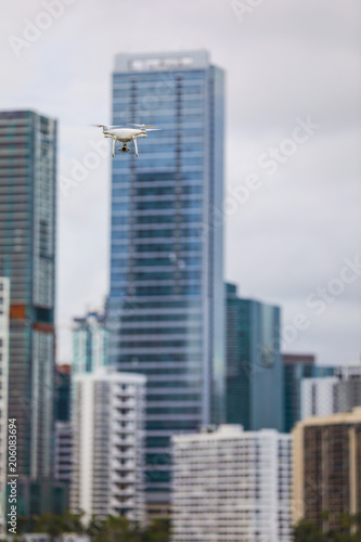 Image of a drone in action with city in background