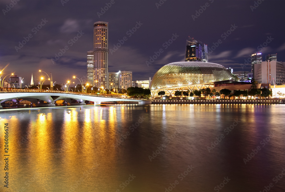 Singapore skyline, night view at Marina Bay with Esplanade theatre.