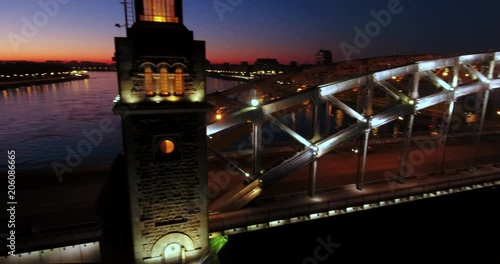 Aerial beautiful sunset view of the bridge with towers at night with the illuminated light, Saint Petersburg, Russia