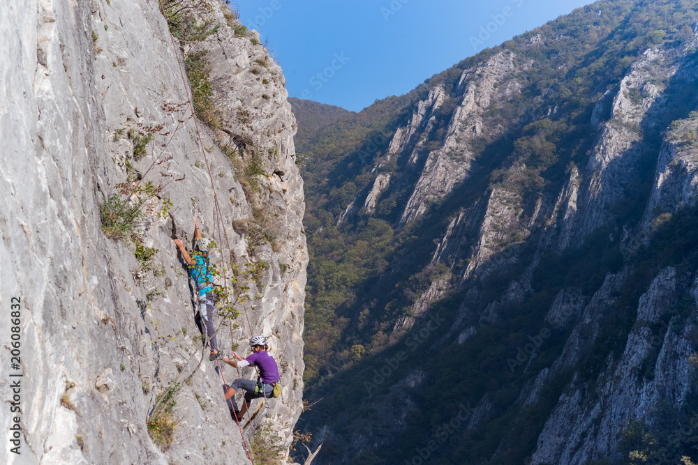 Team climbers rise up to the top of mountain