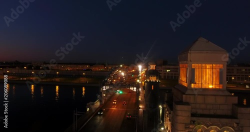 Aerial beautiful sunset view of the bridge with towers at night with the illuminated light, Saint Petersburg, Russia