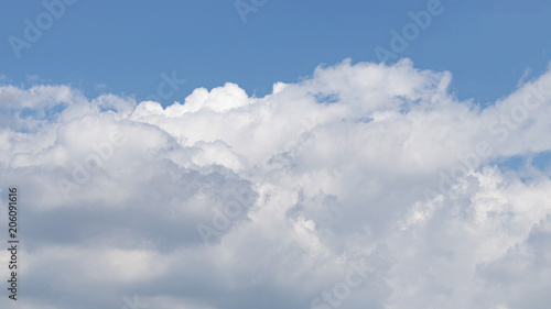 Fototapeta Naklejka Na Ścianę i Meble -  Sky of blue color with big white clouds.