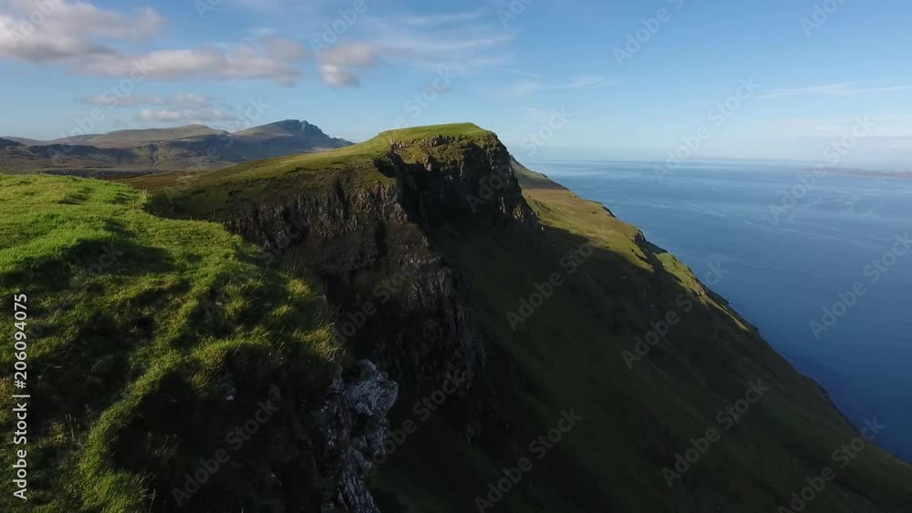 Coastal strip on Skye north of Portree, Scotland. In the distance you can see the Old Man of Storr and parts of the Trotternish Ridge.