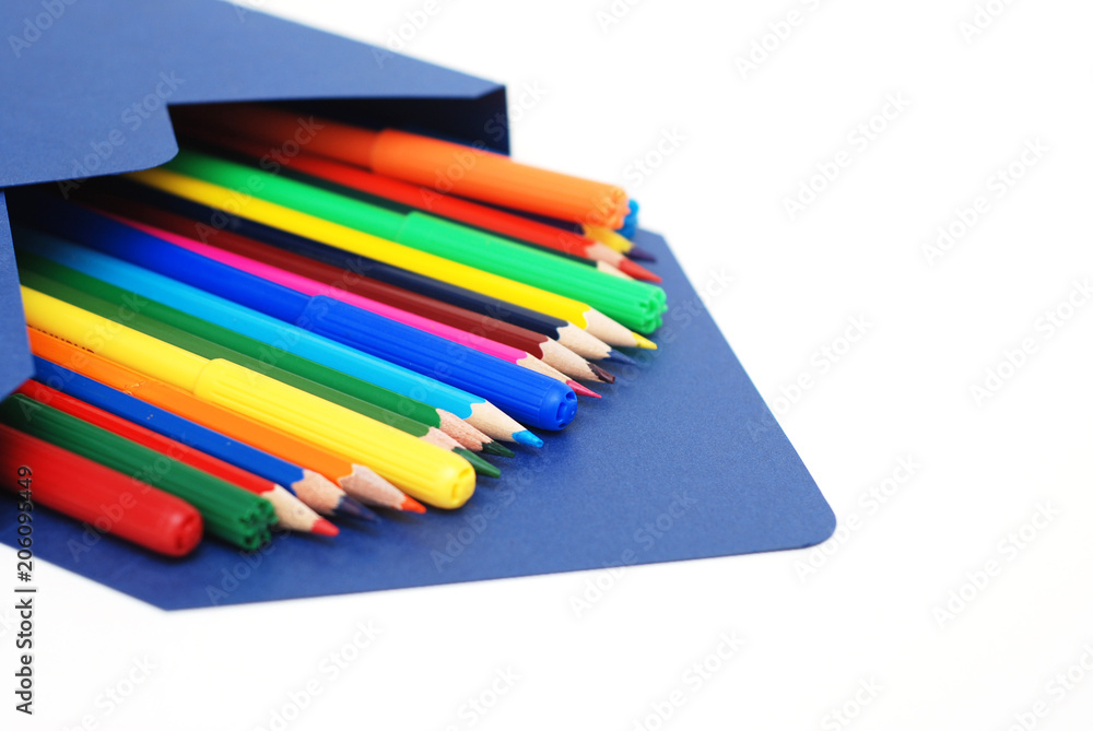 Colored Pencils in blue envelope Isolated on White Background Copy Space School Suplies Colored Pencils in blue envelope Isolated on White Background Copy Space School Suplies