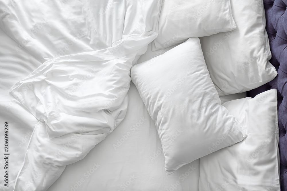 Comfortable bed with white linen at home - obrazy, fototapety, plakaty 