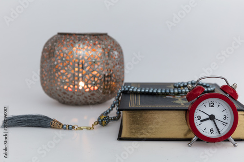 Koran - holy book of Muslims with lantern and rosary . ramadan concept photo