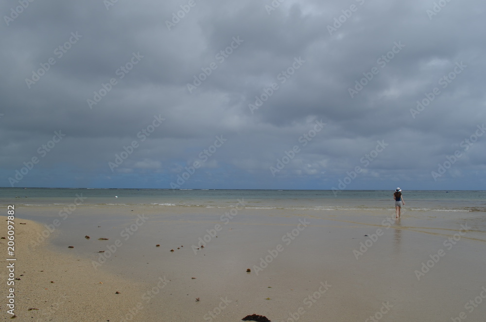 Scenic view of a woman at the beach