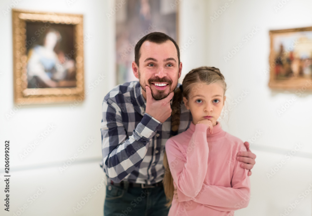 Fototapeta premium Father and small daughter exploring pictorial art