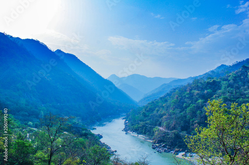 morning top view of Holy Ganges river that flows through Rishikesh passage of mountains looks divine 