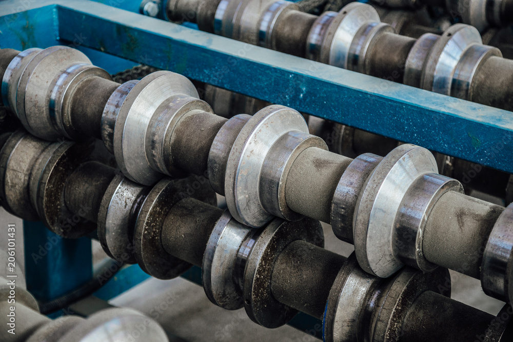 Profiling rolls of sheet forming machine close up Profiling rolls of sheet forming machine close up