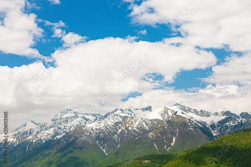 Amazing views in the Caucasus mountains. Snow-capped peaks, blue sky, sunny day