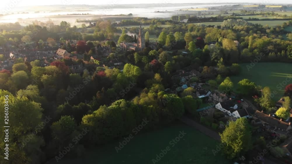 misty fields in morning birds eye view