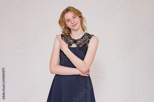 portrait of a beautiful blonde girl on a white background showing a emotions in different poses