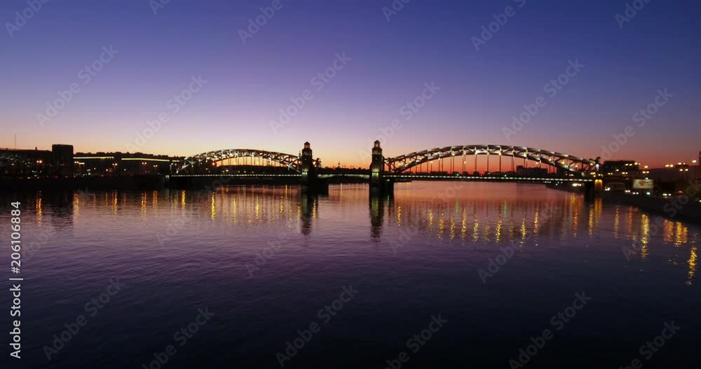 Aerial beautiful sunset view of the bridge with towers at night with the illuminated light, Saint Petersburg, Russia Aerial beautiful sunset view of the bridge with towers at night with the illuminated light, Saint Petersburg, Russia