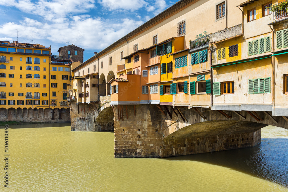 Medieval Ponte Vecchio bridge across Arno river in Florence, Italy