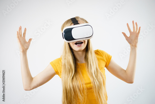 Girl wearing virtual reality goggles.