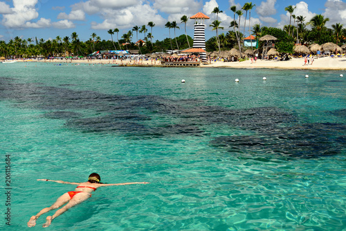 фотографія Relaxing tourist swimming on the Dominicus beach on Dominican Republic