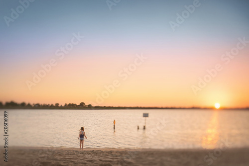 A Young Girl Looking at the Ocean, water, pretty sky, sunset