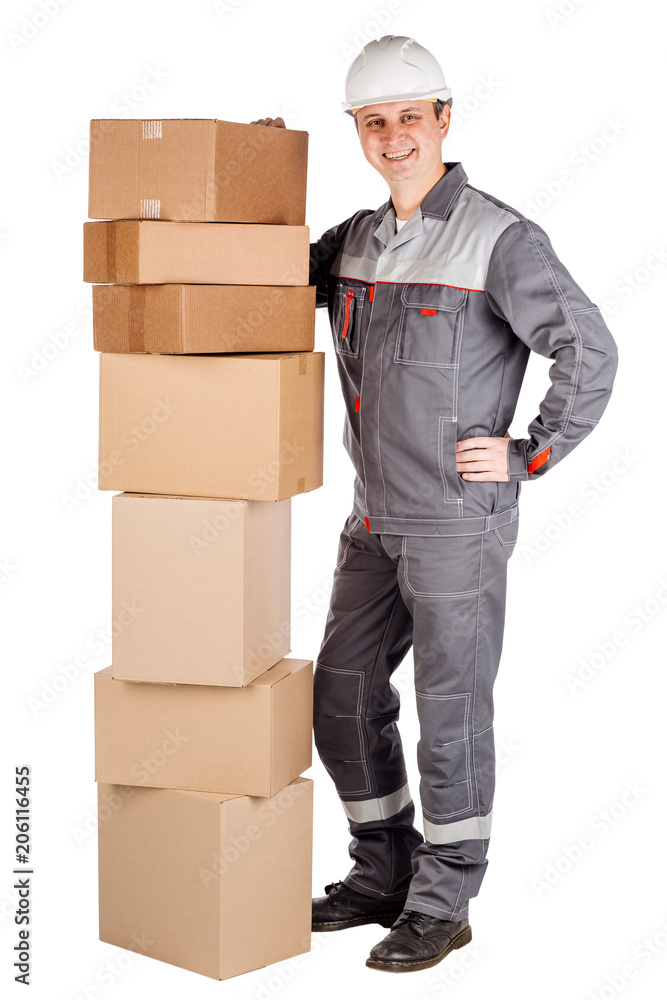 male builder in a helmet with cardbox and looking at camera over white wall background. repair, construction, building, people and maintenance concept. male builder in a helmet with cardbox and looking at camera over white wall background. repair, construction, building, people and maintenance concept.