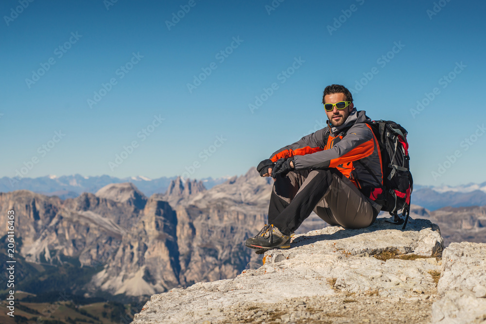 young man watching the beauty of nature in south tyrol, rifugio lagazuio, passo falzarego, italien dolomites
