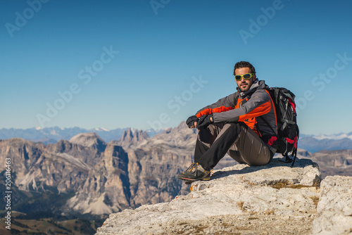 young man watching the beauty of nature in south tyrol, rifugio lagazuio, passo falzarego, italien dolomites