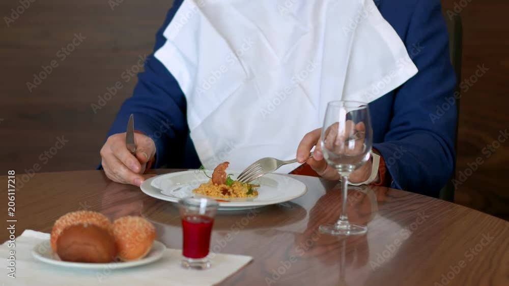 Sad man with bad appetite looking on dish and does not want to try it in cafe Sad man with bad appetite looking on dish and does not want to try it in cafe