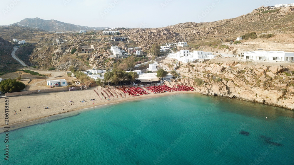 Aerial drone, bird's eye view photo of iconic and famous beach of Super Paradise with sapphire clear waters, Mykonos island, Cyclades, Greece