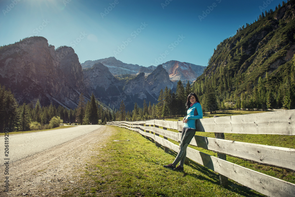 pretty young woman on bicycle in italien dolomites,  south tyrol, platzwiese