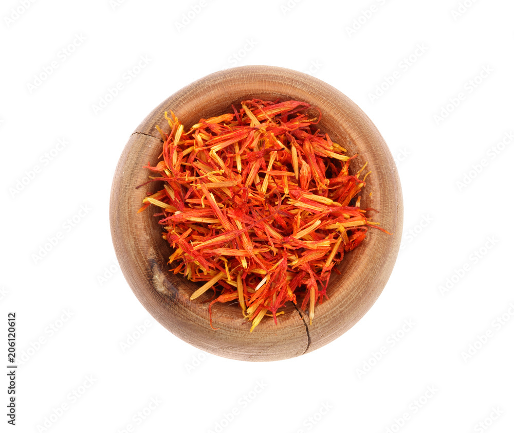 Heap of saffron in wooden bowl isolated on white background. Top view. Flat lay Heap of saffron in wooden bowl isolated on white background. Top view. Flat lay