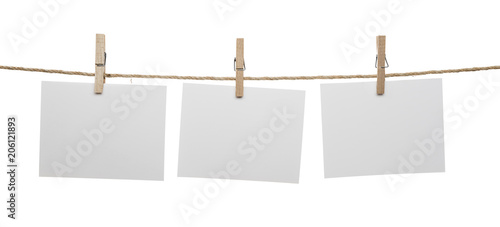 White blank cards with copy space on rope isolated on white background.    photo