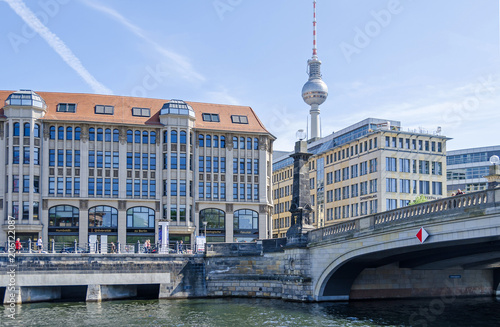 Spreeufer with the building of the theological faculty, television tower, Spreepalais and Friedrichs Bridge in Berlin photo